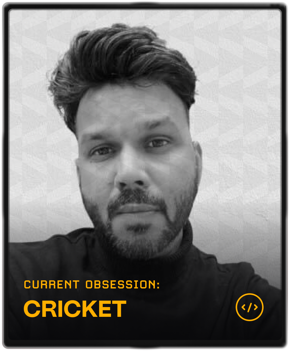 Portrait of a woman with brown hair on a flat gray background.